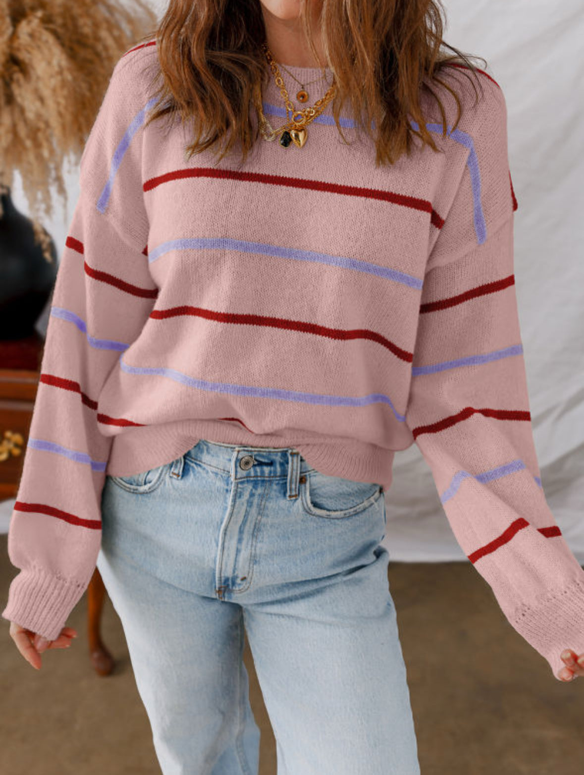 Pink sweater with purple and red stripes